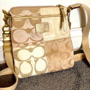 Gold coach crossbody with purple interior